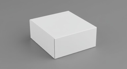 A simple studio shot of a closed white cardboard box on a gray surface with soft lighting effects