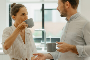 A couple having breakfast in the kitchen