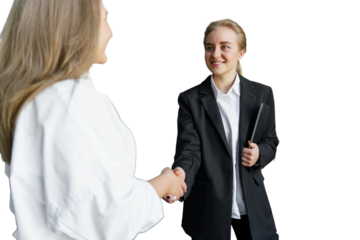Two Professionals Engage in a Friendly Handshake, Symbolizing Collaboration and Mutual Respect in a Bright Office Setting