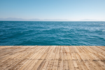 Wooden flloor on pier with blue sea. 