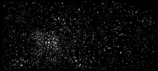 Black background with patches of white paint. Vector drops of paint are sprayed. The effect of dust, grain, and the starry sky. Grunge-style brushes, ink blots, dirty textures.  