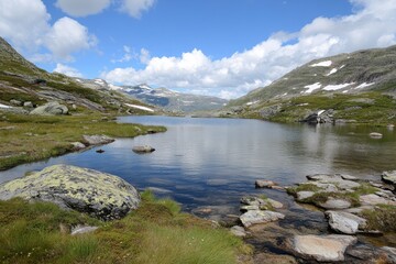 Fototapeta premium Trolltunga Adventure: Hiking through Norway's Stunning Countryside in Summer