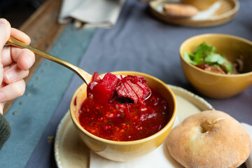 Borscht or borsch in bowl, Ukrainian beetroot soup. Red chowder thick borscht with sour cream