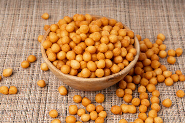 Small pastry balls, fried crispy wheat soup pearls, salad egg puffs or choux pastry