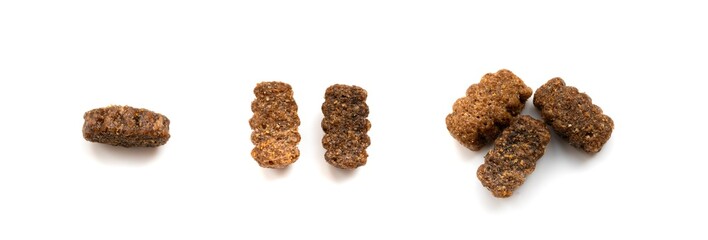 Dry pet food macro pieces isolated, cat kibble closeup, dog pellets, small protein croquettes