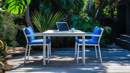 Outdoor patio table and chairs with laptop
