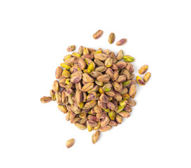 Fried salt pistachio nuts isolated. Baked pistachios pile, roasted green pistache fruits on white