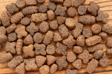 Dry pet food macro pieces, cat kibble closeup, dog pellets, small protein croquettes detailed