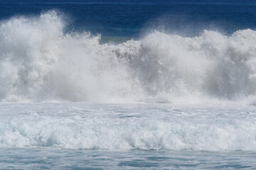 Big strong wave crashing in stormy ocean. 