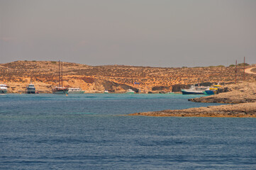 A beautiful blue ocean with a few boats in the water