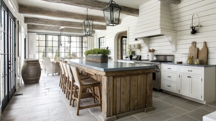 White-washed kitchen with shiplap walls and rustic wooden island  