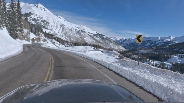POV road trip along the Million Dollar Highway in winter through Colorado mountains 