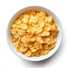 A top down view of a white bowl filled with yellow corn flakes on a white background in bright light