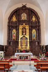 Catholic church interior in Potes, Spain, with its altar