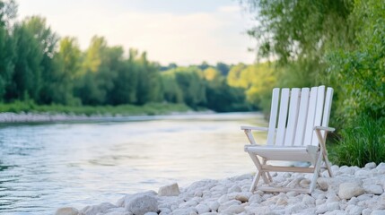 Fototapeta premium White Folding Chair by Riverbank Serene Natural Style High-resolution Soft Lighting Landscape Wide Shot River Rocks Peaceful Contemplation Scenic Riverbank Calm Pastel Tones Ideal for Relaxation Ads