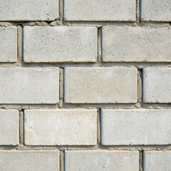 Obraz premium Generative AI illustration of a a close-up view of a concrete block wall, featuring rectangular blocks arranged in a regular, grid-like pattern. 