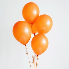 A bunch of orange balloons floating against a plain white background view
