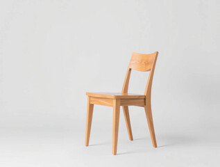 a minimalist and modern style photograph of a single wooden chair placed against a plain, light gray background 