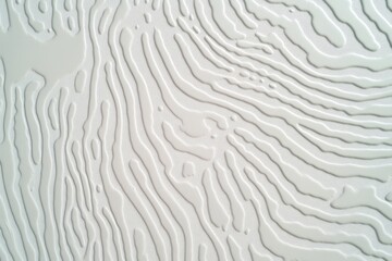 Abstract, textured, light gray surface with wavy lines