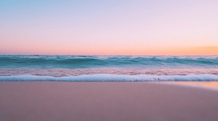 Fototapeta premium Tranquil beach at sunrise with light waves lapping against the shore 