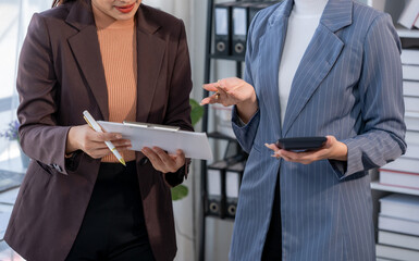 Businesswomen Discussing Financial Data in Office