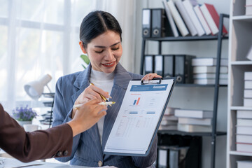 Businesswoman Discussing Financial Data in Office