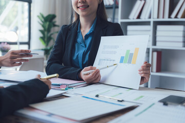 Businesswoman Presenting Financial Data Charts