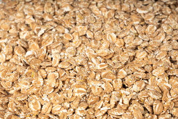 Spelt flakes isolated, dry raw rolled flat oat grains, wheat, oatmeal or bran, barley rye cereals