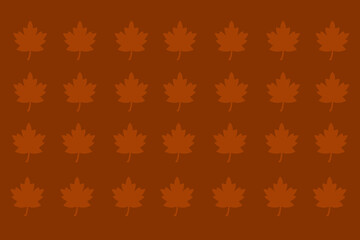 Colorful autumn leaves create a warm pattern in shades of orange and brown for seasonal decor or craft projects