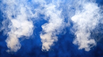 White smoke billowing upward against a deep blue background