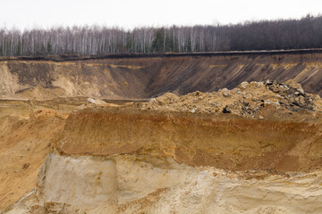 A large sand quarry. The place of sand extraction on an industrial scale.