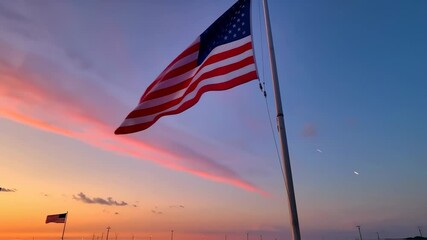 The United States flag flutters in the sunrise - Powered by Adobe