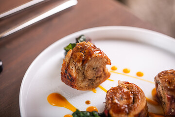 Gourmet meat dish presentation with vibrant sauce and fresh greens culinary art concept