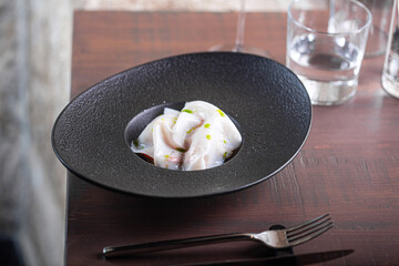 Culinary artistry showcasing delicate dish presentation with vibrant garnishes and elegant tableware dining experience concept