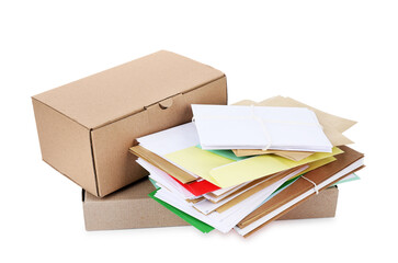 Stack of different paper envelopes and parcels on white background. Post office