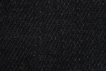 Texture of black denim fabric as background, top view