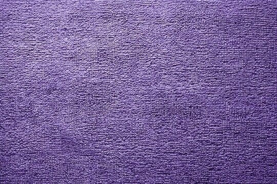 Luxurious lavender chenille fabric creates a soft, inviting texture perfect for cozy backgrounds and calming visuals.