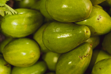 Green avocado pile for sale