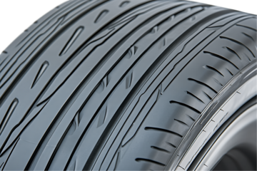 New tire tread pattern, close-up detail, rubber texture.