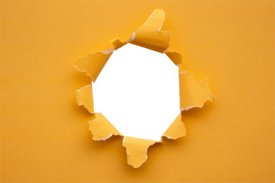 Torn ripped orange paper hole isolated on white background