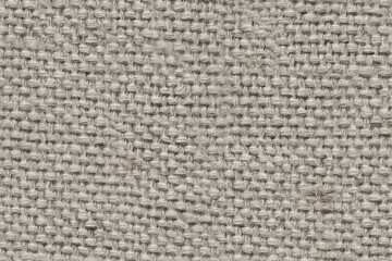 Textured flax fabric showcases a calming, light gray hue, presenting a naturally woven backdrop ideal for minimalist designs.