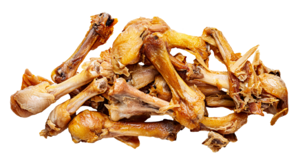 pile of leftover cooked chicken bones on isolated background showing food waste and organic garbage concept in high detail
