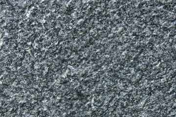 A gray stone wall with a lot of texture