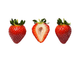 Fresh strawberries arranged in a row, featuring one cut in half to reveal its juicy interior