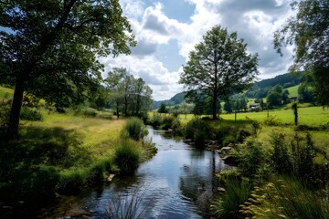 Serene Countryside Landscape with Flowing River and Lush Greenery Under a Bright Cloudy Sky
