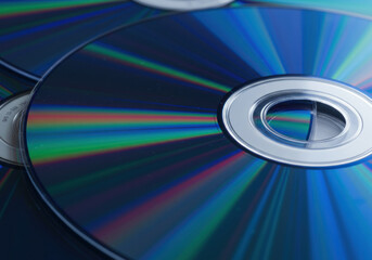 Close-up of a shiny CD reflecting colorful light, surrounded by music notes and headphones.