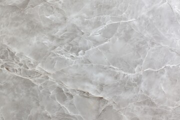 Obraz premium A grey stone with a lot of texture and a few small holes