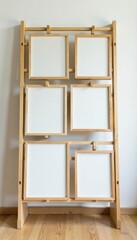 Modern wooden rack with several empty frames, neutral backdrop , interior, modern interior, home