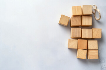 Wooden blocks arranged on a surface, symbolizing building and constructing, representing labor and effort for May Day.