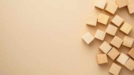 Wooden blocks scattered on a surface, symbolizing creation, construction, and building, related to labor and effort for May Day.